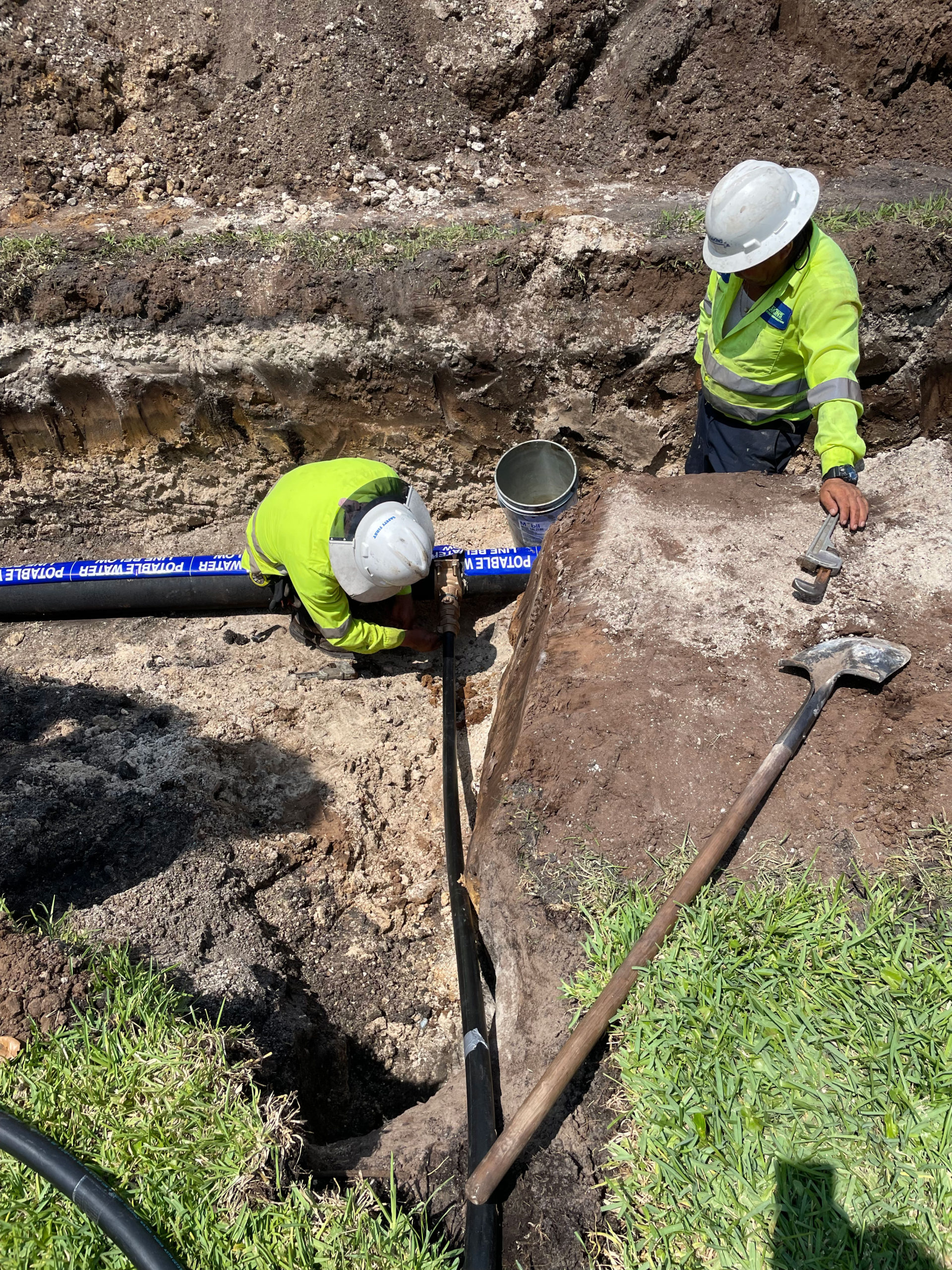 construction workers with pipe